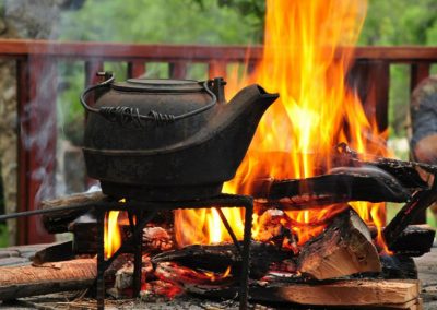 kettle-boiling-next-to-a-hot-fire